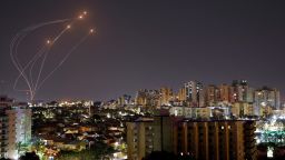 Streaks of light are seen as Israel's Iron Dome anti-missile system intercept rockets launched from the Gaza Strip, as seen from Ashkelon on Friday. 