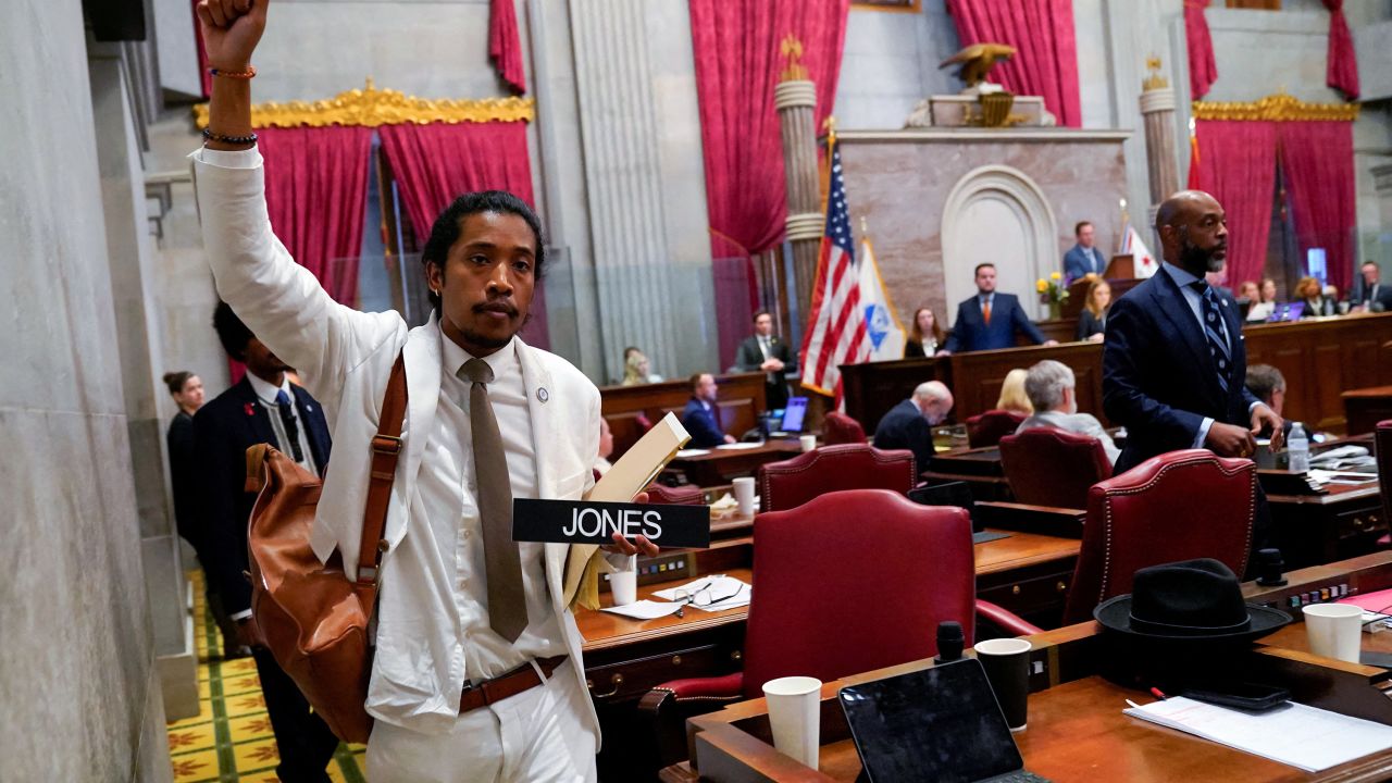 Justin Jones carries his name tag after a vote at the Tennessee House of Representatives to expel him.