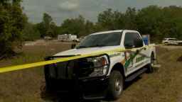 Police cordon off an area near one of the crime scenes in Ocklawaha, Florida.