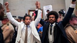 Justin Pearson and Justin Jones raise their hands after being expelled from their seats in Nashville, Tennessee, on April 6.