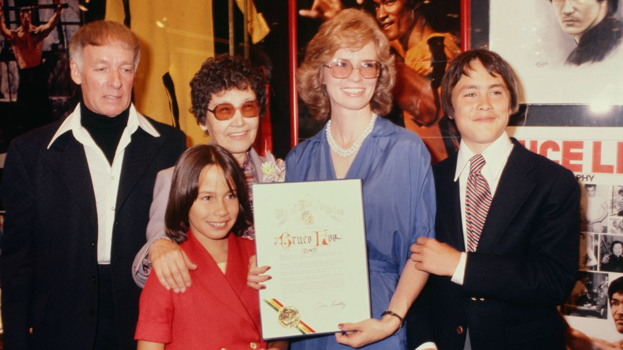 (From left) An unidentified man, Bruce Lee's mother, Linda Cadwell and children Brandon, right, and Shannon celebrate Bruce Lee Day in 1979 in Los Angeles. 