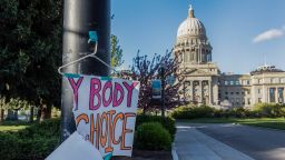 A sign reading "My body, my choice," is taped to a hanger taped to a streetlight in front of the Idaho state Capitol Building in Boise, Idaho, May 3, 2022.