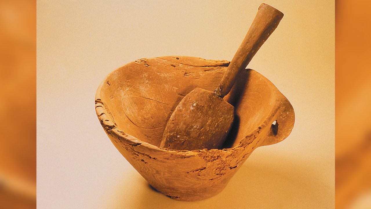 Archaeologists found a wooden bowl and spoon among the artifacts at the ancient burial site. 