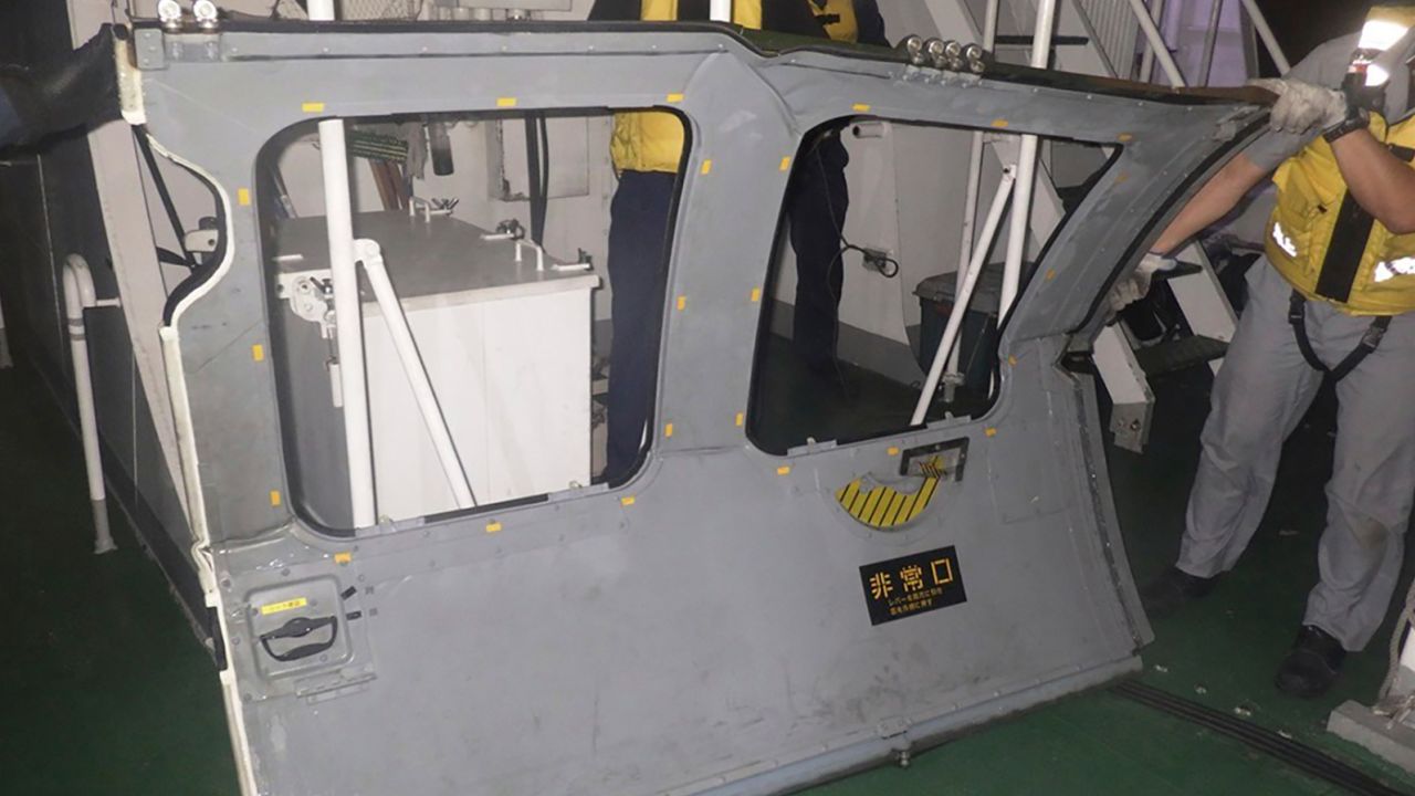 This photo provided by the 11th Regional Japan Coast Guard Headquarters shows a door that the coast guard retrieved from the sea, off Miyako Island, Okinawa Prefecture, southern Japan, on April 7.