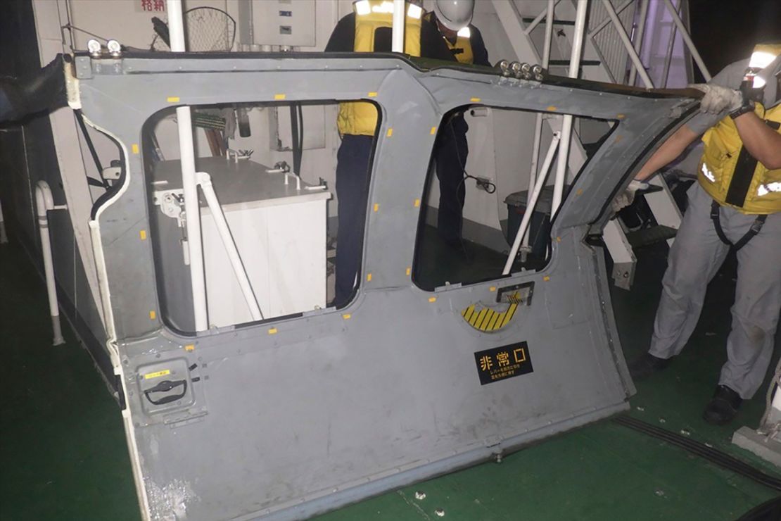This photo provided by the 11th Regional Japan Coast Guard Headquarters shows a door that the coast guard retrieved from the sea, off Miyako Island, Okinawa Prefecture, southern Japan, on April 7.
