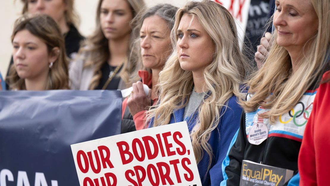 Former University of Kentucky swimmer Riley Gaines, second from right, stands during a rally on January 12, 2023, outside of the NCAA Convention in San Antonio. 