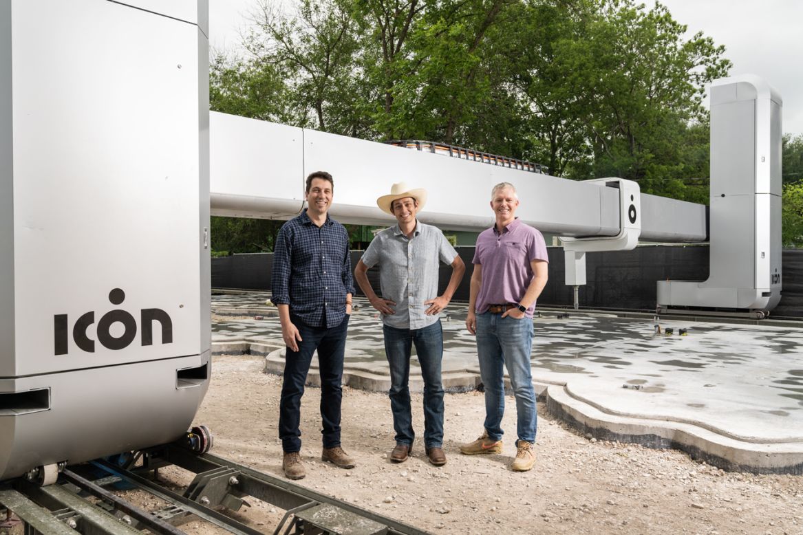 Pictured, ICON co-founders Alexander Le Roux, Jason Ballard and Evan Loomis pose next to one of the company's Vulcan 3D printing systems in 2021. ICON is launching Initiative 99, a design competition with a prize fund of $1 million, for homes that can be built for $99,000 or less. Ballard described it as "a call to arms for the global architecture and design community."