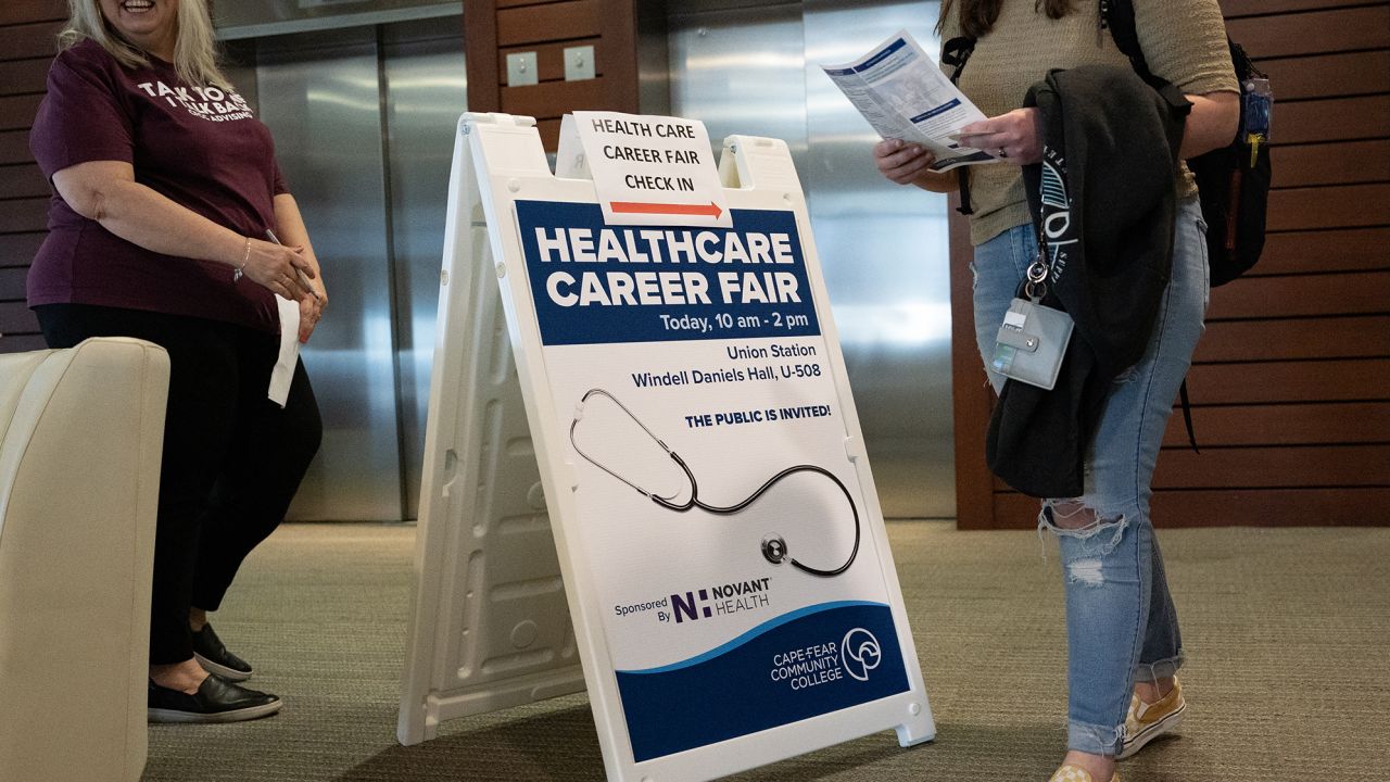 A sign for a healthcare career fair at Cape Fear Community College in Wilmington, North Carolina, on Wednesday, Feb. 28, 2023. 