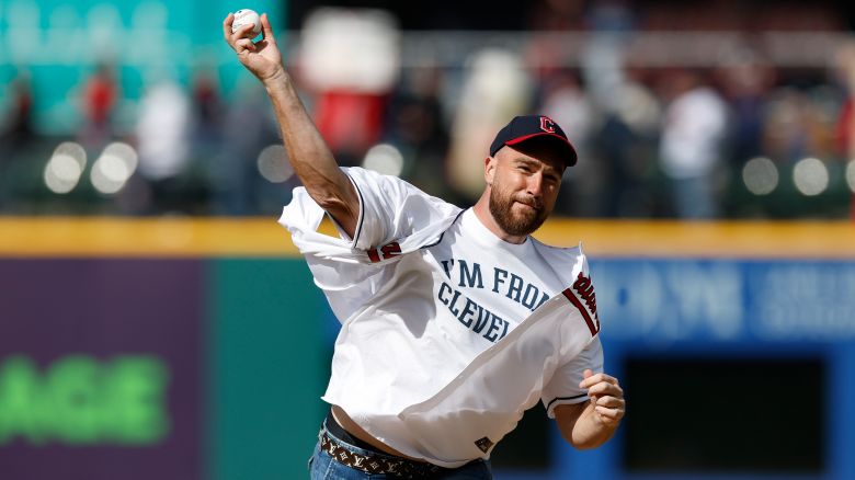 Kansas City Chiefs tight end Travis Kelce throws out the ceremonial first pitch before a baseball game between the Cleveland Guardians and the Seattle Mariners, Friday, April 7, 2023, in Cleveland. 