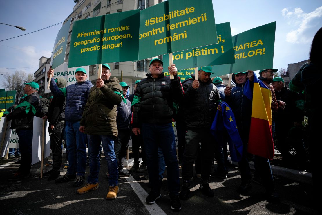 "The Romanian farmer, geographically European, practically alone," read a banner at the protest in Bucharest.