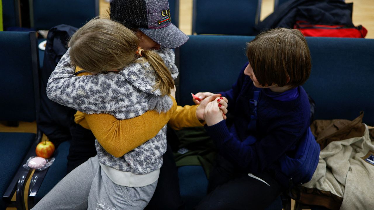 Anastasiia holds her daughter Valeriia and son Maksym in Kyiv, Ukraine April 8, 2023. 