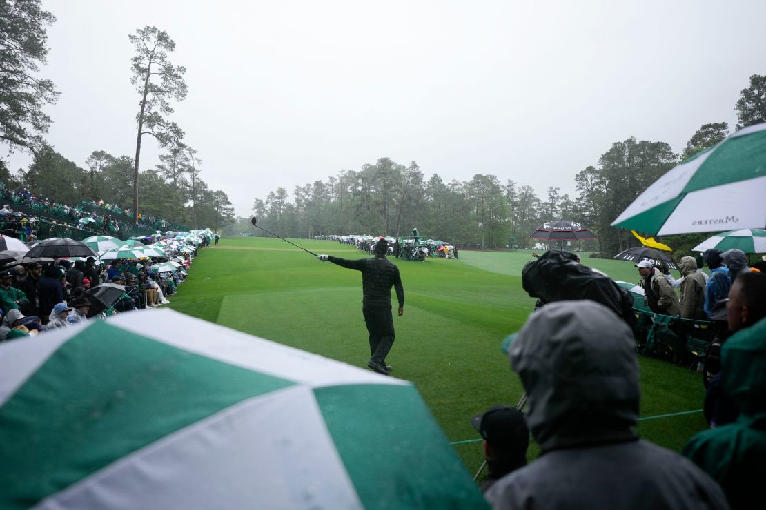 Woods points in the direction of his tee shot on the 14th hole during the third round. 