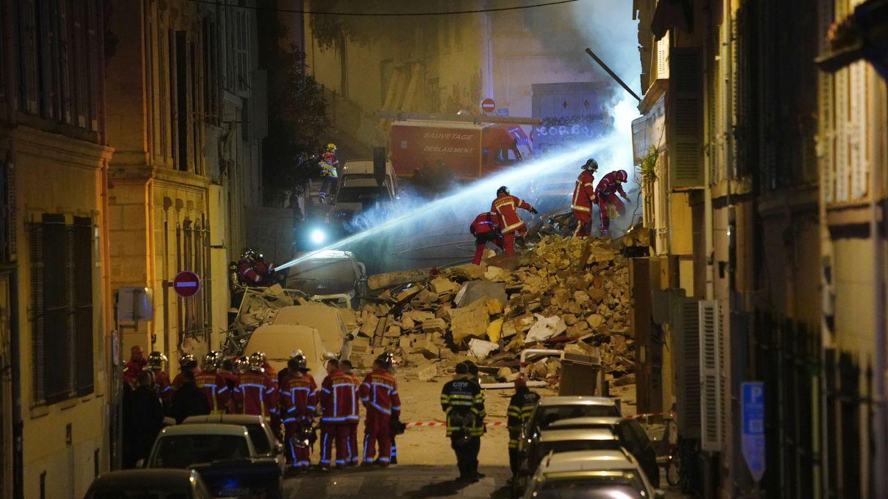 Firefighters worked to clear the rubble after the building collapsed early Sunday morning.