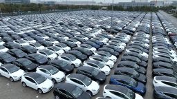 SHANGHAI, CHINA - MARCH 30: Aerial view of Tesla electric vehicles to be shipped aboard sitting parked at Nangang Port on March 30, 2023 in Shanghai, China. (Photo by Shen Chunchen/VCG via Getty Images)