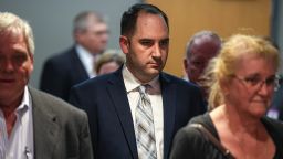 Daniel Perry walks into a Travis County courtroom last month in Austin.