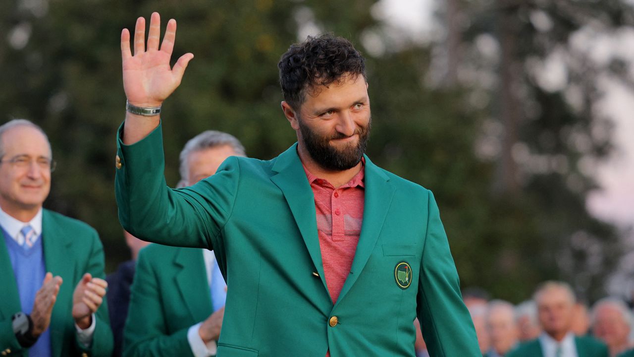 Rahm waves in his new green jacket.