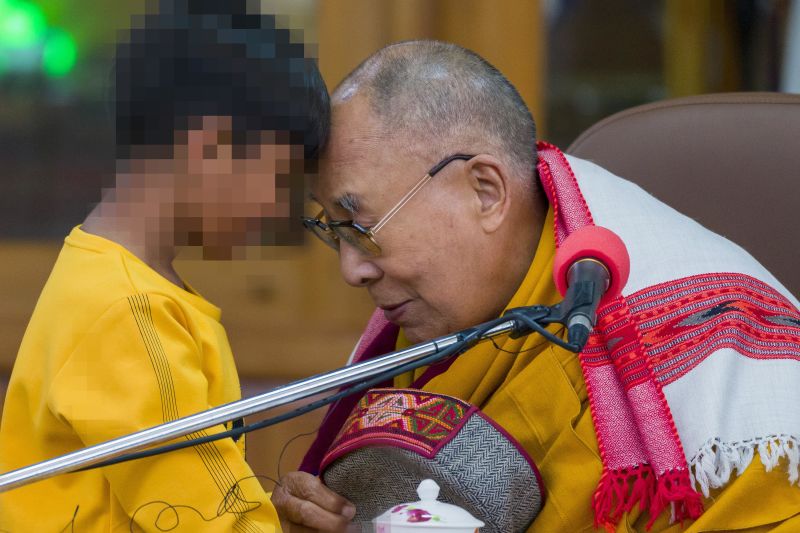 Dalai Lama apologizes after video kissing a boy on the lips and asking him to suck his tongue photo