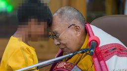 Tibetan spiritual leader the Dalai Lama touches foreheads with a young boy before addressing a group of students at the Tsuglakhang temple in Dharamshala, India, Tuesday, Feb. 28, 2023. (AP Photo/Ashwini Bhatia)
