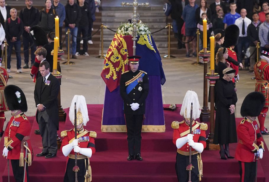 Prince William, center, and other grandchildren of Queen Elizabeth II stand vigil at her coffin in September 2022. She was lying in state at Westminster Hall.
