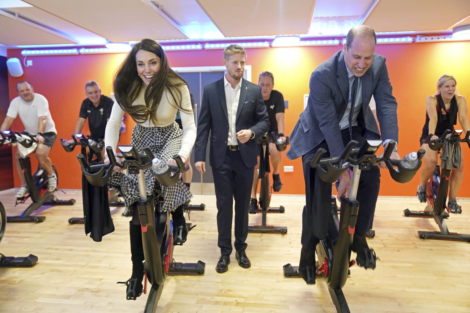 William and Catherine take part in a spin class during while visiting a fitness center in Port Talbot, Wales, in February 2023.