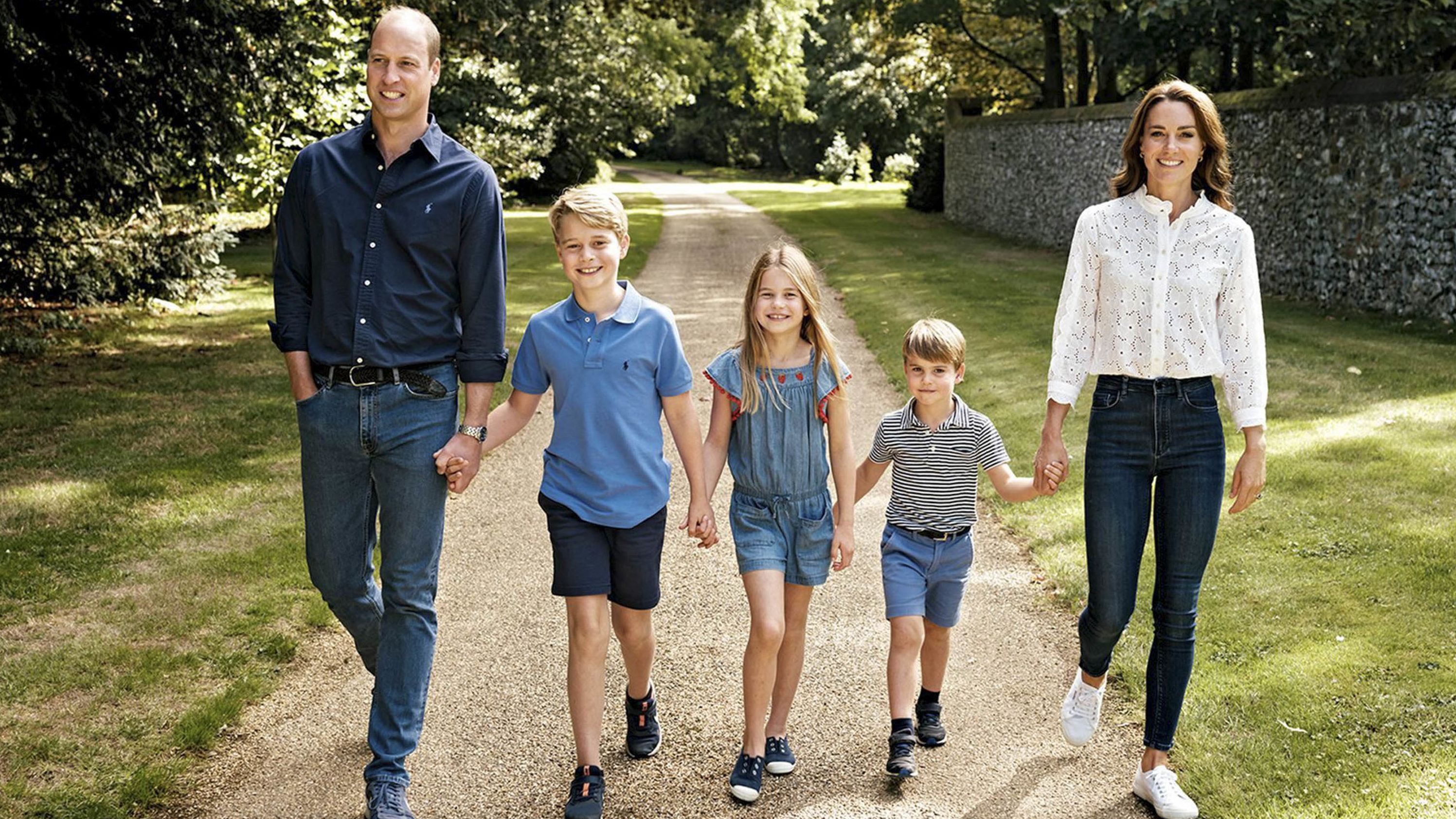 Britain's Prince William and his wife, Catherine, walk with their three children -- from left, George, Charlotte and Louis -- in Norfolk, England. The photo was featured on the family Christmas card in December 2022.