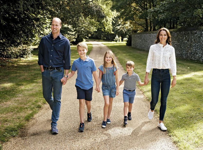 Britain's Prince William and his wife, Catherine, walk with their three children -- from left, George, Charlotte and Louis -- in Norfolk, England. The photo was featured on the family Christmas card in December 2022.