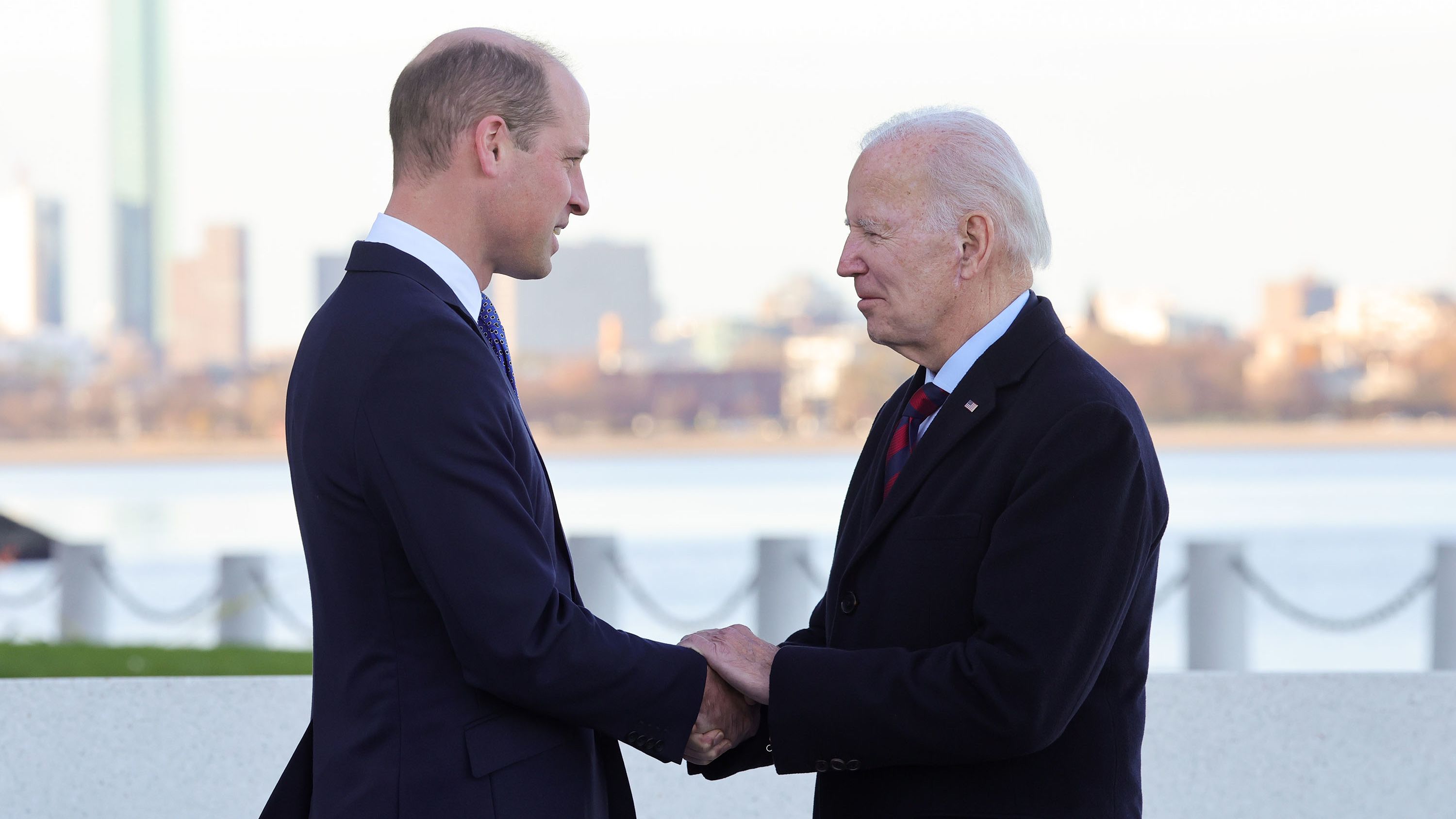 Prince William shakes hands with US President Joe Biden during a <a href="https://www.cnn.com/2022/12/01/world/gallery/royals-boston-visit-william-kate/index.html" target="_blank">visit to Boston</a> in December 2022. The two men shared "warm memories" of the Queen, according to Kensington Palace. William and Catherine were in Boston to attend the Earthshot Prize Awards that William founded two years prior.