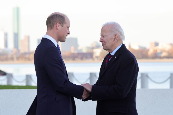 Prince William shakes hands with US President Joe Biden during a <a href="index.php?page=&url=https%3A%2F%2Fwww.cnn.com%2F2022%2F12%2F01%2Fworld%2Fgallery%2Froyals-boston-visit-william-kate%2Findex.html" target="_blank">visit to Boston</a> in December 2022. The two men shared "warm memories" of the Queen, according to Kensington Palace. William and Catherine were in Boston to attend the Earthshot Prize Awards that William founded two years prior.