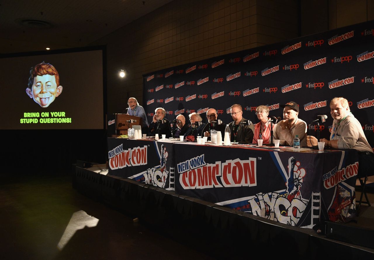 Mad Magazine editor-in-chief John Ficarra speaks with the publication's artists and writers Sam Viviano, Al Jaffee, Nick Meglin, Dick DeBartolo, Mark Fredrickson, Teresa Burns Parkhurst, Joe Raiola and Charlie Kadau at New York Comic Con on October 6, 2017.
