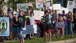 In this September 2018 photo, protest organizer Neringa Zymancius of Darian leads protesters in a chant in front of the Oak Brook headquarters of Sterigenics in Oak Brook, Illinois.