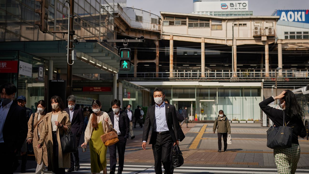 Morning commuters near Akihabara station in Tokyo in March. Workers in Japan have been grappling with stagnant wages, leading to a government push for businesses to hike pay.