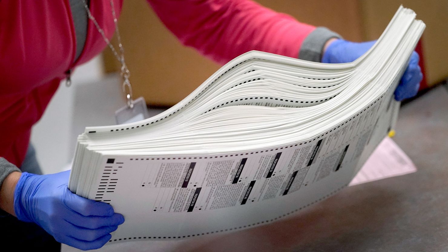 In this November 2022 photo, an election worker boxes tabulated ballots inside the Maricopa County Recorder's Office in Phoenix.