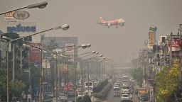 An Air Asia plane descends towards Chiang Mai International Airport amid high levels of air pollution in Chiang Mai on April 10, 2023.
