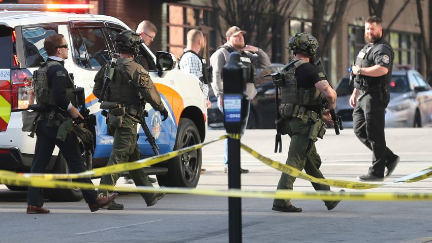 Multiple agencies arrive at a building after a shooting took place in Louisville, Kentucky, on Monday, April 10, 2023.