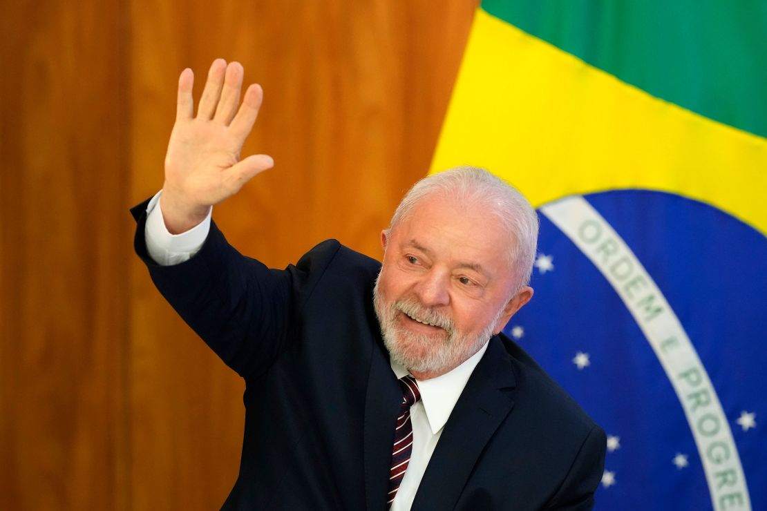Lula waves as he arrives for a ministerial meeting at Planalto Palace in Brasilia on Monday, April 10, 2023. 