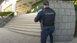 Officer N. Wilt's bodycam shows Officer C. Galloway approaching the bank in downtown Louisville where a shooting took place. 