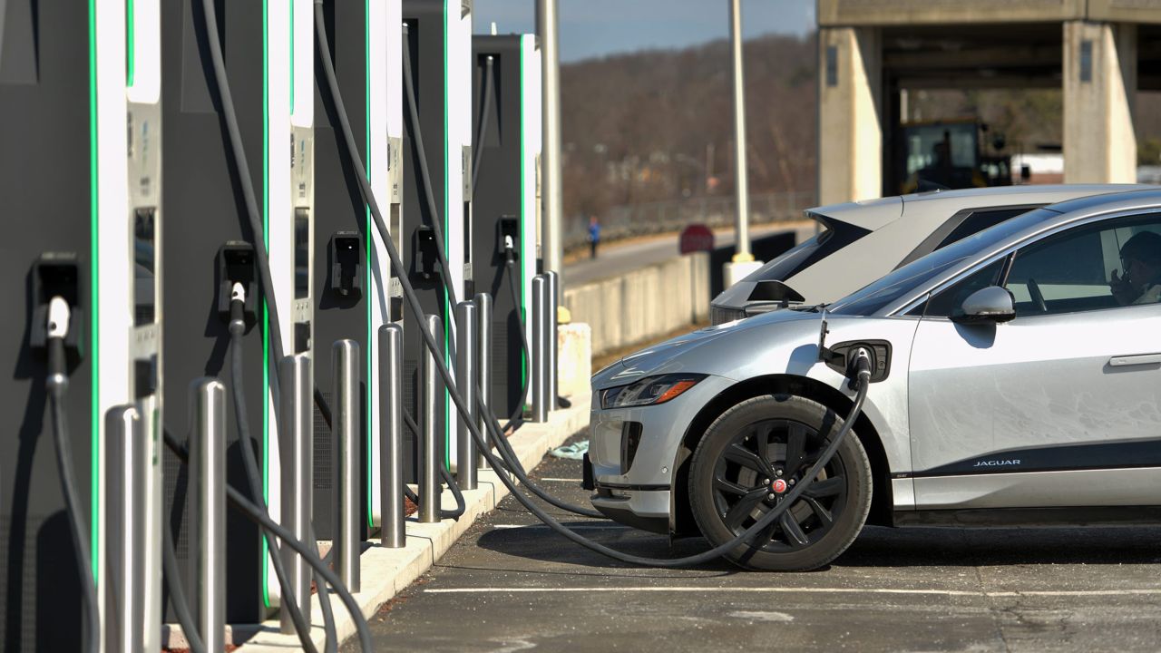 Electric vehicles power up at a charging station.