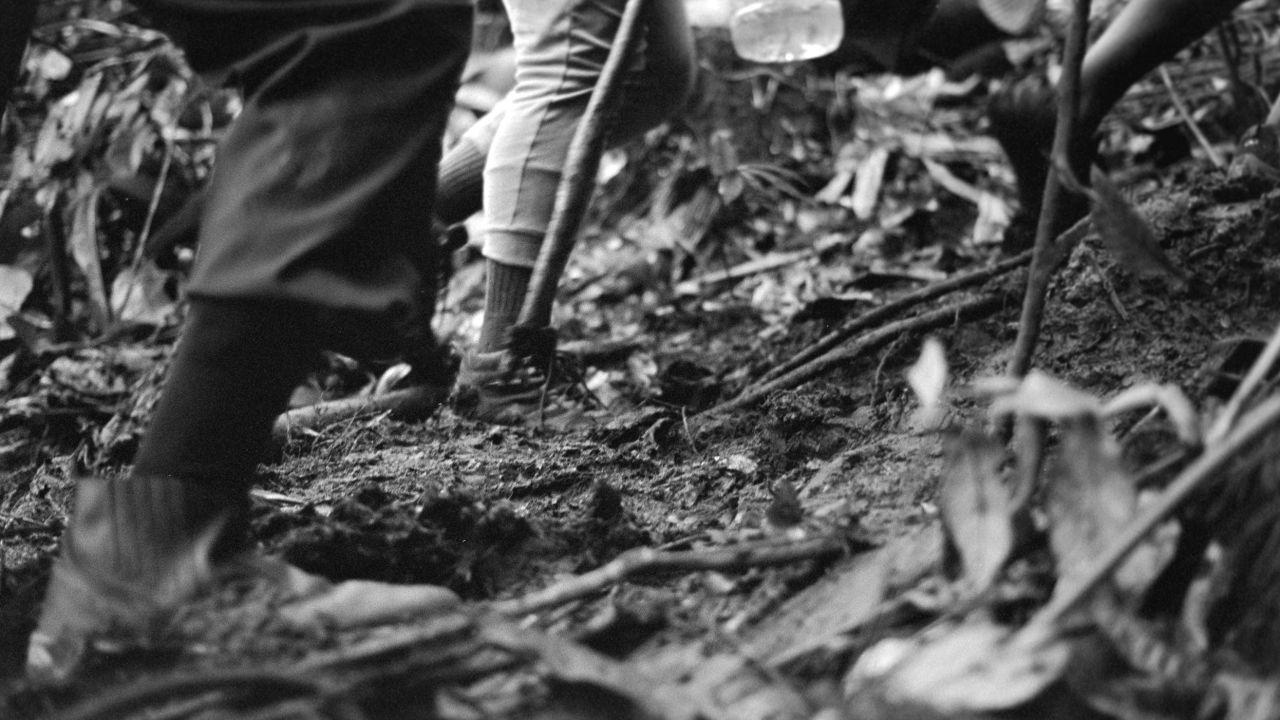 Most migrants are ill-equipped to hike the unforgiving terrain. It's dry season, yet the ground still sucks you in with every step. 