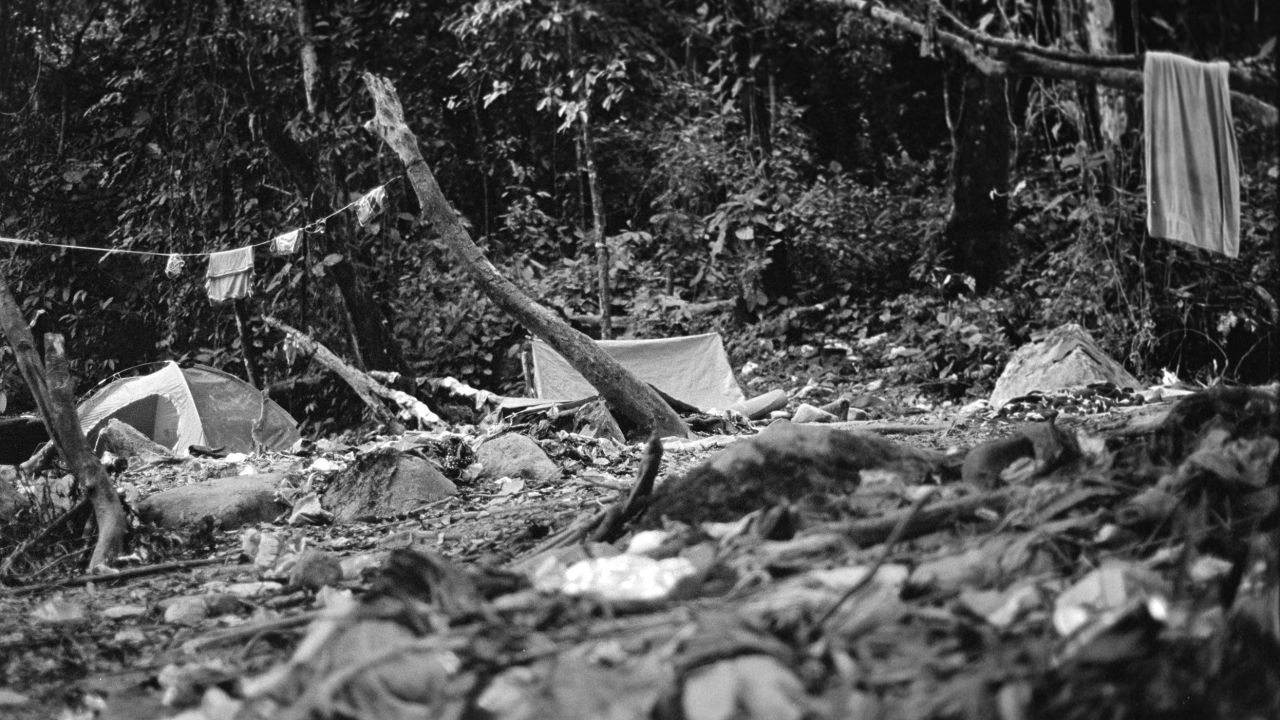 The old route, near Tres Bocas, is covered in garbage, camping tents and clothing abandoned by migrants.