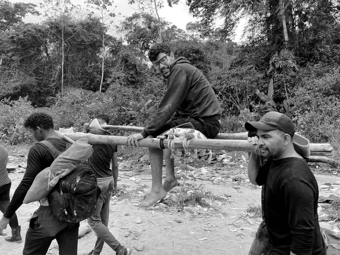 A Venezuelan man, who was injured and stuck on the route for days, is carried on a makeshift stretcher made by other migrants.