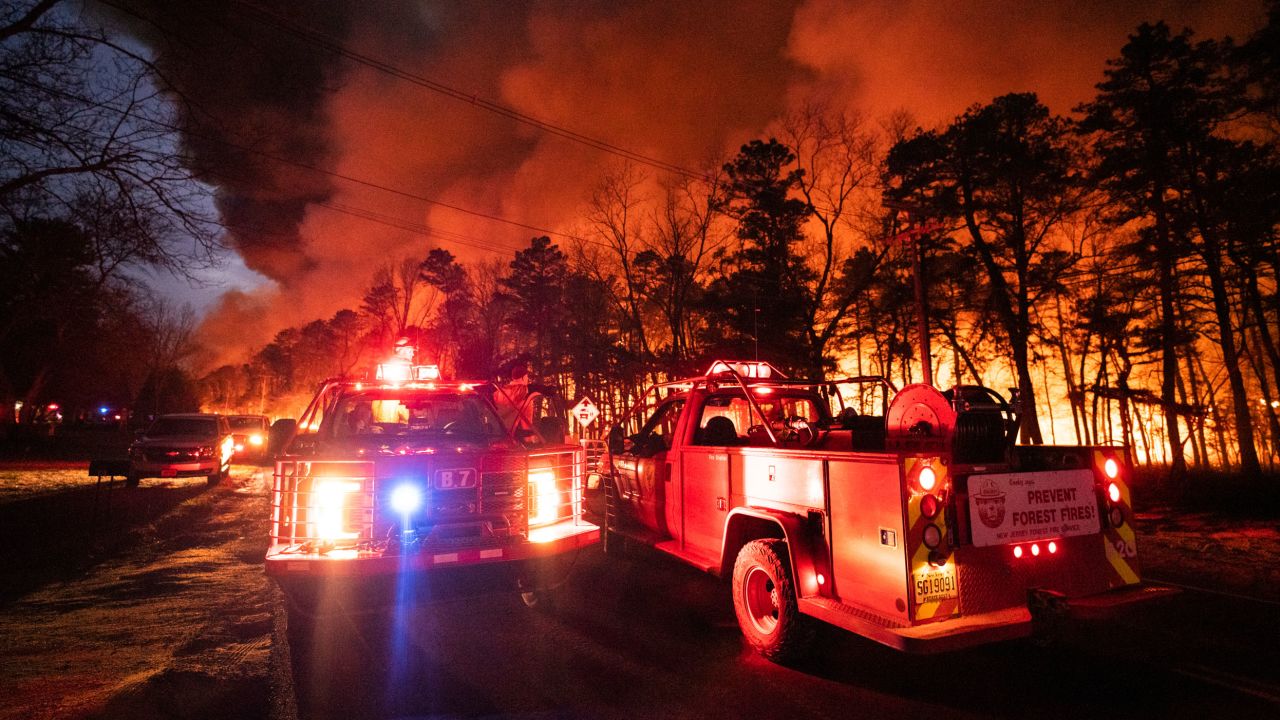 A massive forest fire burns in Ocean County, New Jersey, early Wednesday, April 12, 2023.