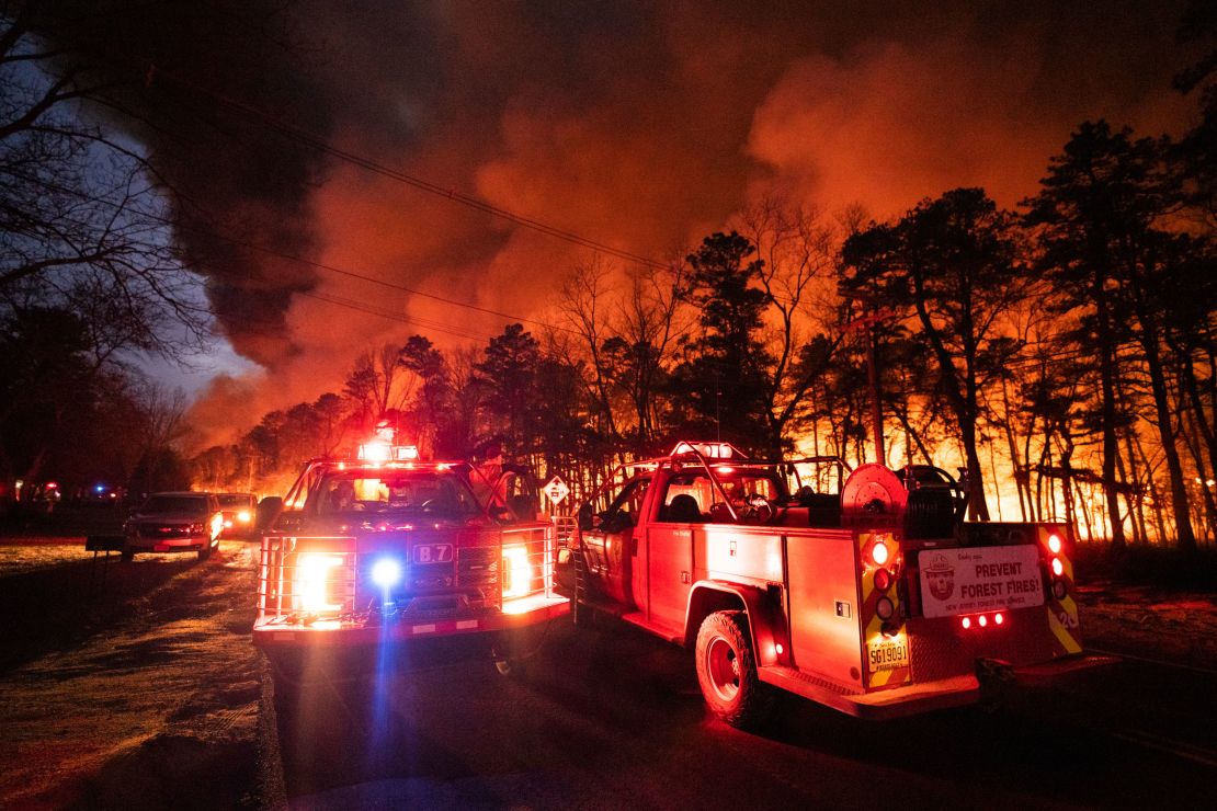 A massive forest fire burns in Ocean County, New Jersey, early Wednesday, April 12, 2023.