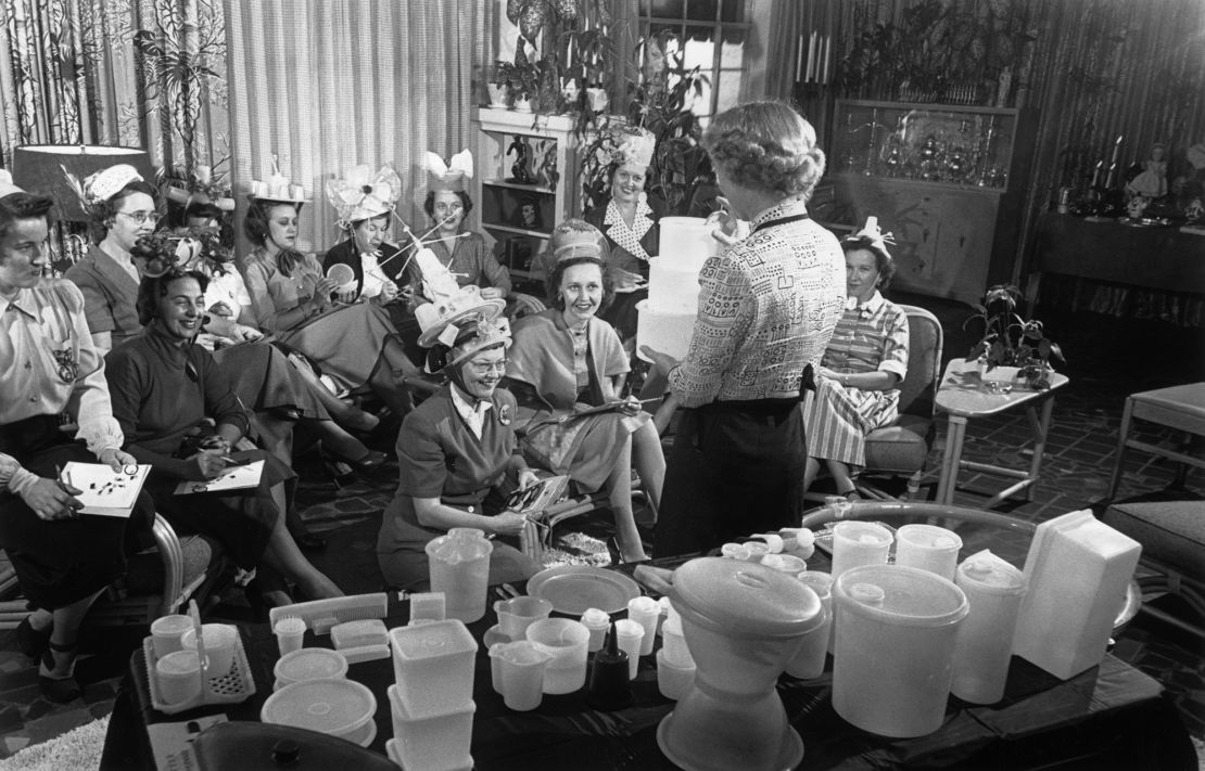 Tupperware house parties were the only way to buy the brand's plastic food containers. The parties were hosted by women in their homes and were both popular social and marketing events. (circa 1950)