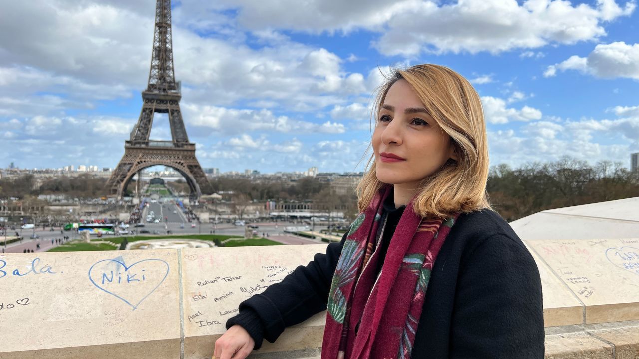 Massi Kamari, an Iranian activist living in Paris, says Iranian intelligence threatened to send her family to Tehran's Evin prison if she continued her activism against the regime abroad.