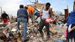 Residents recover possessions from homes that were destroyed by the March 25, 2023 tornado in Rolling Fork, Mississippi. 