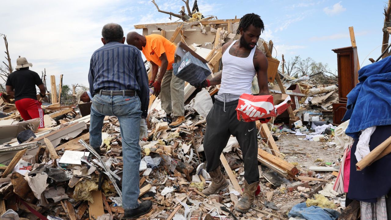 Residents recover possessions from homes that were destroyed by the March 24 tornado in Rolling Fork, Mississippi. 