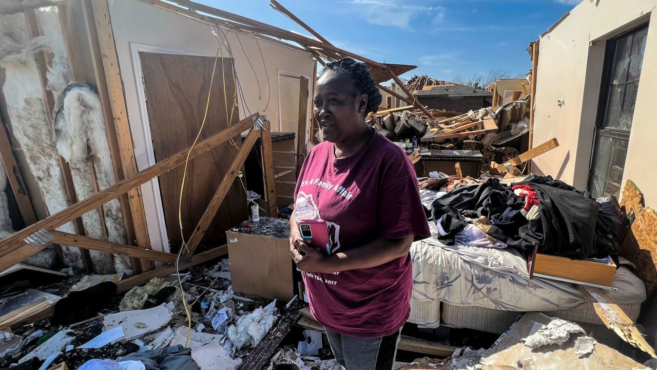 Shirley Stamps stands in the rubble of her home in the aftermath of the Rolling Fork tornado. 