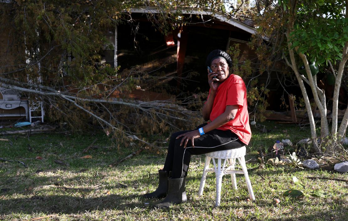 71-year-old Emma Lee Williams sits in her front yard after the  EF-4 Rolling Fork tornado destroyed her house.
