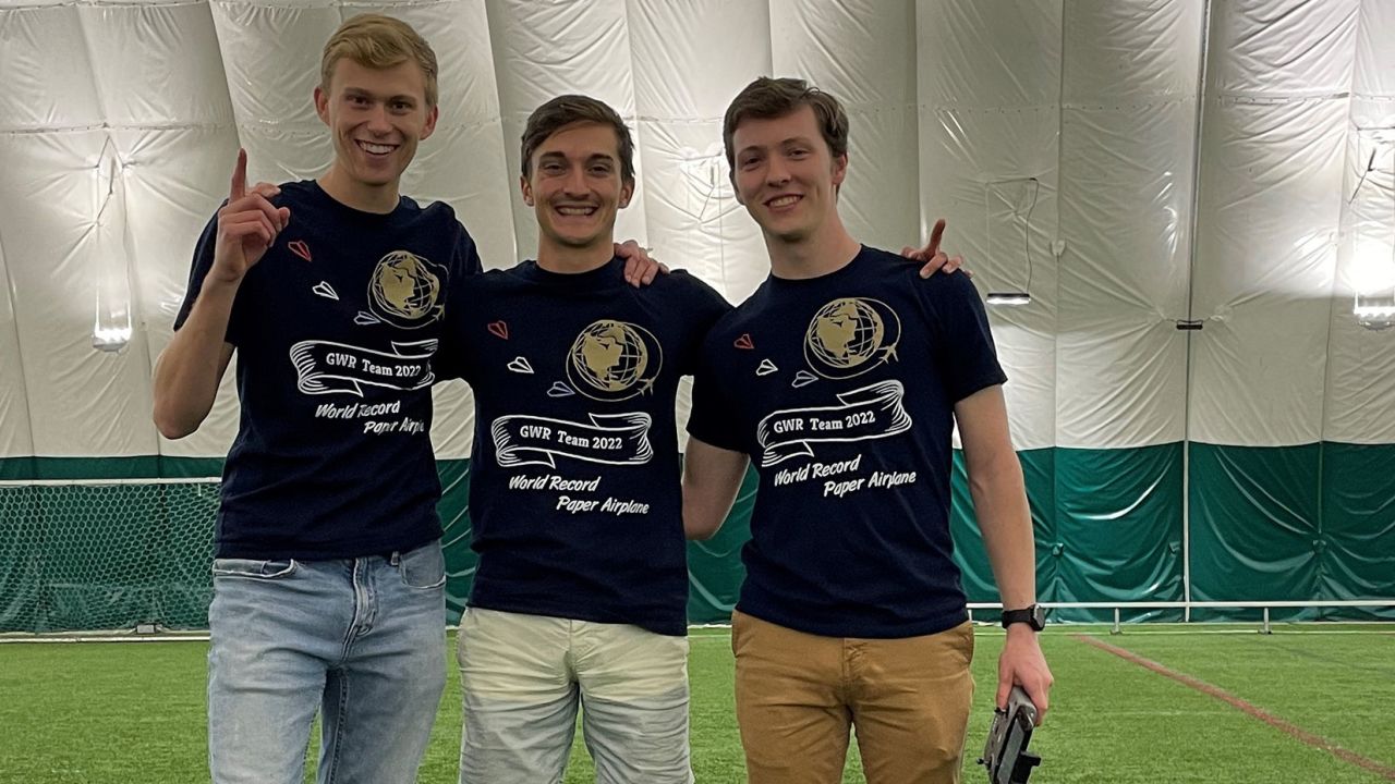 Nathan Erickson (from left), Dillon Ruble and Garrett Jensen are aerospace engineers turned world record holders with their paper plane design inspired from hypersonic vehicles.
