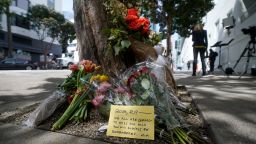 Flowers sit at a tree in front of the building where a technology executive was fatally stabbed outside of in San Francisco, Thursday, April 6, 2023. Details of how tech executive Bob Lee came to be fatally stabbed in downtown San Francisco early Tuesday were scarce as friends and family continued to mourn the man they called brilliant, kind and unlike others in the industry.